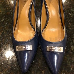 Coach  Navy blue patent and leather pumps.